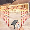 12 Pack Christmas Decorations Outdoor Solar Candy Cane Lights, Waterproof Solar Pathway Markers Yard Lights with Star, 8 Modes Xmas Decorations for Garden Yard Decor