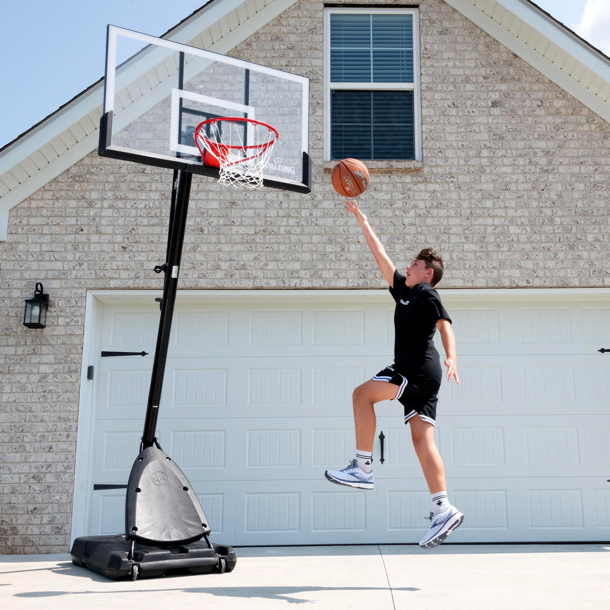 Spalding 54-Inch Portable Basketball Hoop with Shatter-Proof Polycarbonate Backboard, Adjustable ExactaHeight System & Pro Slam Rim-Outdoor Play